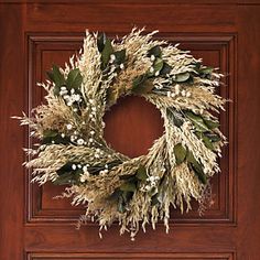 a wreath is hanging on the front door