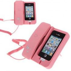 a pink cell phone is hooked up to a charger and plugged into an ipod