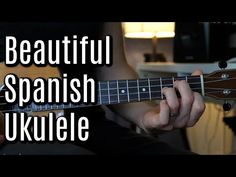 a person playing a guitar with the words beautiful spanish ukulele