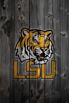 the lsu tigers logo on a wooden fence