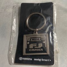 a keychain with the toyota logo on it's front and back sides