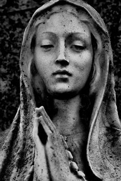 a black and white photo of a statue