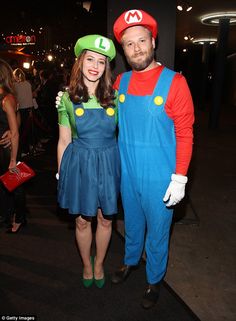 a man and woman dressed up as mario and luigi