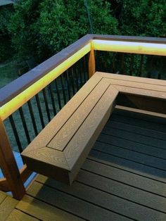 a wooden bench sitting on top of a red deck