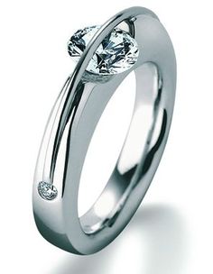 a white gold ring with two diamonds on it