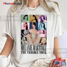 a woman wearing a white t - shirt with pictures of marilyn monroe and other women on it