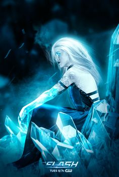 a woman sitting on top of a rock next to an ice crystal tower in the dark