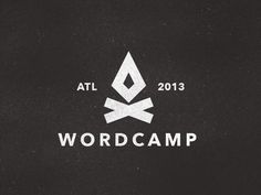 a black and white logo with the words wordcamp on it