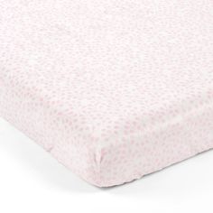 a pink and white polka dot crib sheet