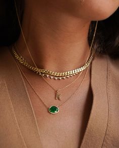 14k solid gold, pave diamond, and a beautifully handpicked free form emerald, available in yellow, white and rose gold, hanging from a 16''-18'' adjustable chain. Timeless and perfectly handcrafted, wear it up or down, by itself or layered. Size of Emerald: Approx. 13mm(W) by 11mm(H) Diamond Carat Weight: Approx. 0.08 ctw Diamond Quality: VS Total Weight: Approx. 2 grams Due to the nature of this item all stones may vary in color and inclusions making each piece a one of a kind Standard Producti Gold Emerald Necklace With Adjustable Chain, 14k Gold Green Necklace With Diamond Accents, Green 14k Gold Necklace With Diamond Accents, Fine Jewelry Diamond Necklace With Curb Chain As Gift, Green 14k Gold Necklace With Adjustable Chain, Gold Emerald Necklace With Diamond Accents For May Birthstone, Gold Emerald Necklace With Diamond Accents, Emerald Mangalsutra, Emerald Necklace Gold