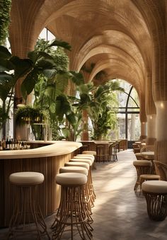 an indoor bar with stools and plants on the walls, along with wooden tables