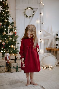 This dress combines the rich and luxurious feel of red velvet with a classic holiday pattern. It's a perfect blend of elegance and festive charm. The red velvet adds a touch of luxury to the dress. It's soft, warm, and has a delightful sheen that's perfect for special occasions. A design, in festive holiday colors, adds a cozy and traditional feel to the dress. Go back to the full catalogue here: https://www.etsy.com/shop/WeddingBabySlovakia?ref=profile_header Holiday Red Velvet Dress, Red Velvet Dress For Winter, Red Velvet Winter Dress, Red Velvet Holiday Dress, Baby Girl Holiday Dress, Elegant Christmas Outfit, Christmas Red Dress, Christmas Dress Toddler, Toddler Holiday Dress