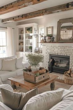 a living room filled with furniture and a fire place in front of a brick fireplace