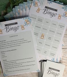 three baby shower game cards sitting next to each other