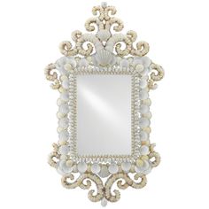 an ornate mirror with shells and pearls on the frame, isolated against a white background