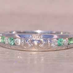 The Adare: Irish Signed Designer Natural Emerald And Diamond Claddagh Ring In White Gold. This Stunning Ring Showcases The Iconic Claddagh Design At Its Center, With The Arms Of The Claddagh Hands Adorned In An Alternating Pattern Of Channel-Set Emeralds And Diamonds. Crafted With Precision In 14 Karat White Gold, The Ring Is Currently Sized At 8, With The Option For Adjustment To Any Finger Size Available For An Additional Charge Upon Request. Signed By Its Esteemed Designer Sol D'or Solvar And Meticulously Made In Ireland, This Ring Bears Authentic Irish Hallmarks, Reflecting Its Heritage And Exceptional Craftsmanship. Compare At A Retail Price Of $1625 From The Designer. The Claddagh Ring Diamond Claddagh Ring, Irish Symbols, Ring Bear, Claddagh Ring, Claddagh Rings, Irish Heritage, Irish Traditions, Channel Set, Natural Emerald