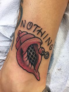 a person with a tattoo on their foot that says nothing