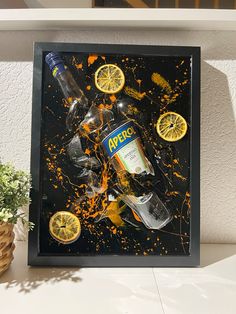 an art piece with alcohol bottles and lemons