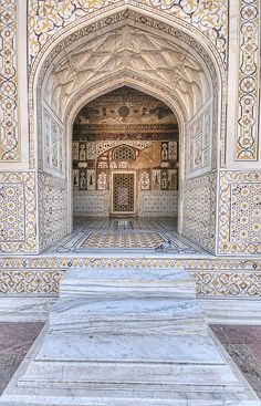 the entrance to an intricately decorated building