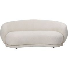 a white couch sitting on top of a white floor