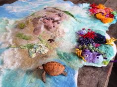 there is a turtle and other sea creatures on the rugs that are made out of felt