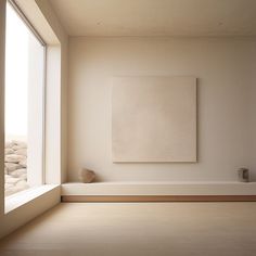 an empty room with a large painting on the wall