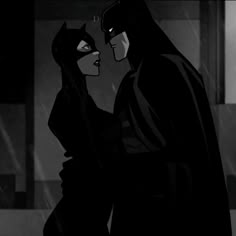 batman and catwoman kissing in the rain