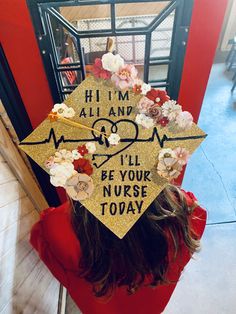 a woman wearing a graduation cap that says hi i'm all and i'll be your nurse today