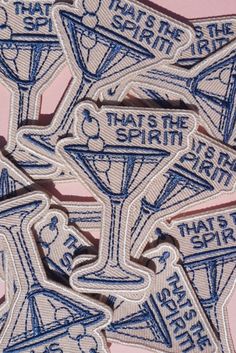 three embroidered patches with the words, that's the spirit in blue and white