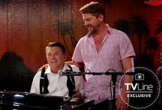 two men standing next to each other in front of a piano and microphone on the set of tvline