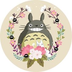 a totoro surrounded by flowers and plants