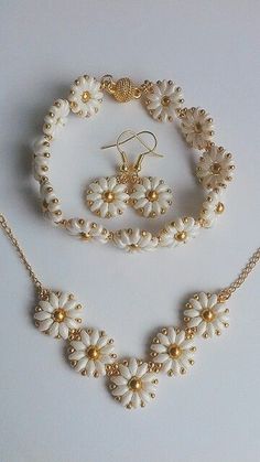 a necklace and bracelet with flowers on it