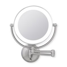 a round mirror mounted to the side of a wall