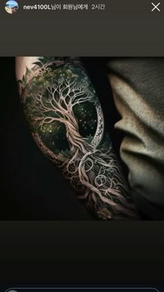 a person with a tree tattoo on their arm