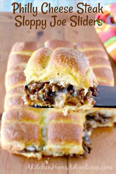 a piece of philly cheese steak sloppy joe sliders on a cutting board with a knife