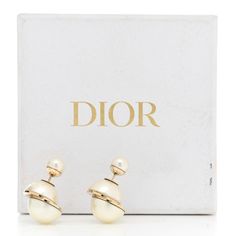 This is an authentic pair of CHRISTIAN DIOR Pearl Mise En Dior Tribal Earrings in Gold. These asymmetrical tribal-inspired earrings feature a small faux pearl stud in the front and a larger split one, set in gold detailing subtly peeps out from behind the earlobe. Dior Earrings, Dior Jewelry, Earrings In Gold, Pearl Studs, One Set, Gold Details, Earrings Gold, Faux Pearl, Christian Dior