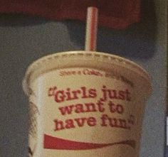 a paper cup with a straw sticking out of it's side and the words girls just want to have fun written on it