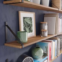 some shelves with books and pictures on them