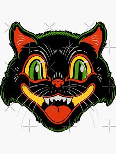 a black cat's face with green eyes and yellow teeth is featured in this image