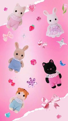 a group of stuffed animals sitting on top of a pink background with butterflies and stars