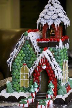 a gingerbread house decorated with candy and icing