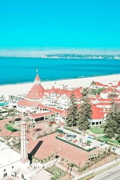 an aerial view of the beach and buildings