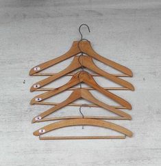 wooden clothes hangers are arranged in a row