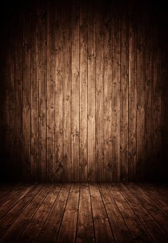 an empty wooden room with dark wood flooring