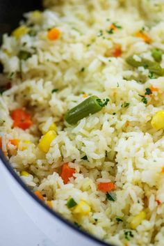 rice and vegetables are mixed together in a pot