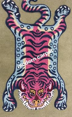 a rug with a pink tiger on it's face and the words modern carpet