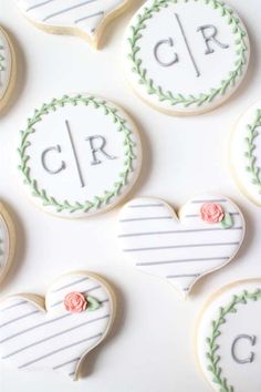 decorated cookies with the letters cr and c on them are arranged next to each other