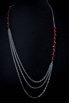 Light chain layered necklace with Red/Siam Swarovski crystals.   Makes a great handmade gift to give on birthdays, holidays, on valentine's day or just to say thank you. Can be worn symmetrically or asymmetrically around the neck. Great for layering! Each necklace is packaged in a box, ready for gift giving. Matching earrings:  https://anelladesigns.com/collections/catalogue/products/red-crystal-teardrop-earring-with-white-pearls * * * * * * * * * * * * * * * * * * * * * * * See a full descripti Chain Layered Necklace, Holiday Necklace, Crystal Teardrop Earrings, Light Chain, Layered Chain, Red Necklace, Handmade Jewelry Diy, Red Crystals, Layered Necklace