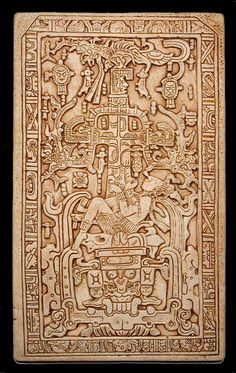 an intricately carved book with carvings on it