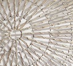 an umbrella made out of sticks is shown in this image, it looks like the inside of